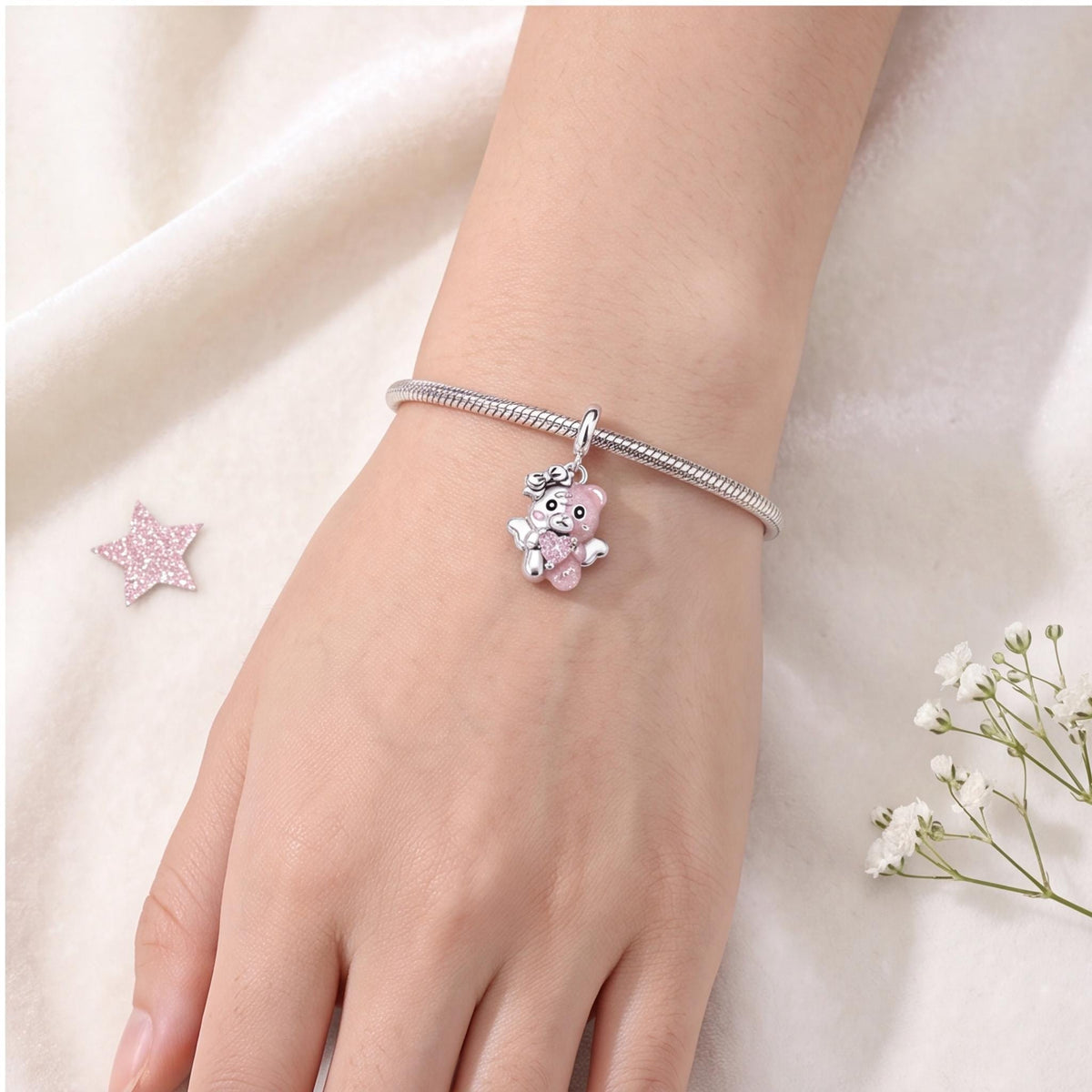 Angel Bear Charm styled as a gift