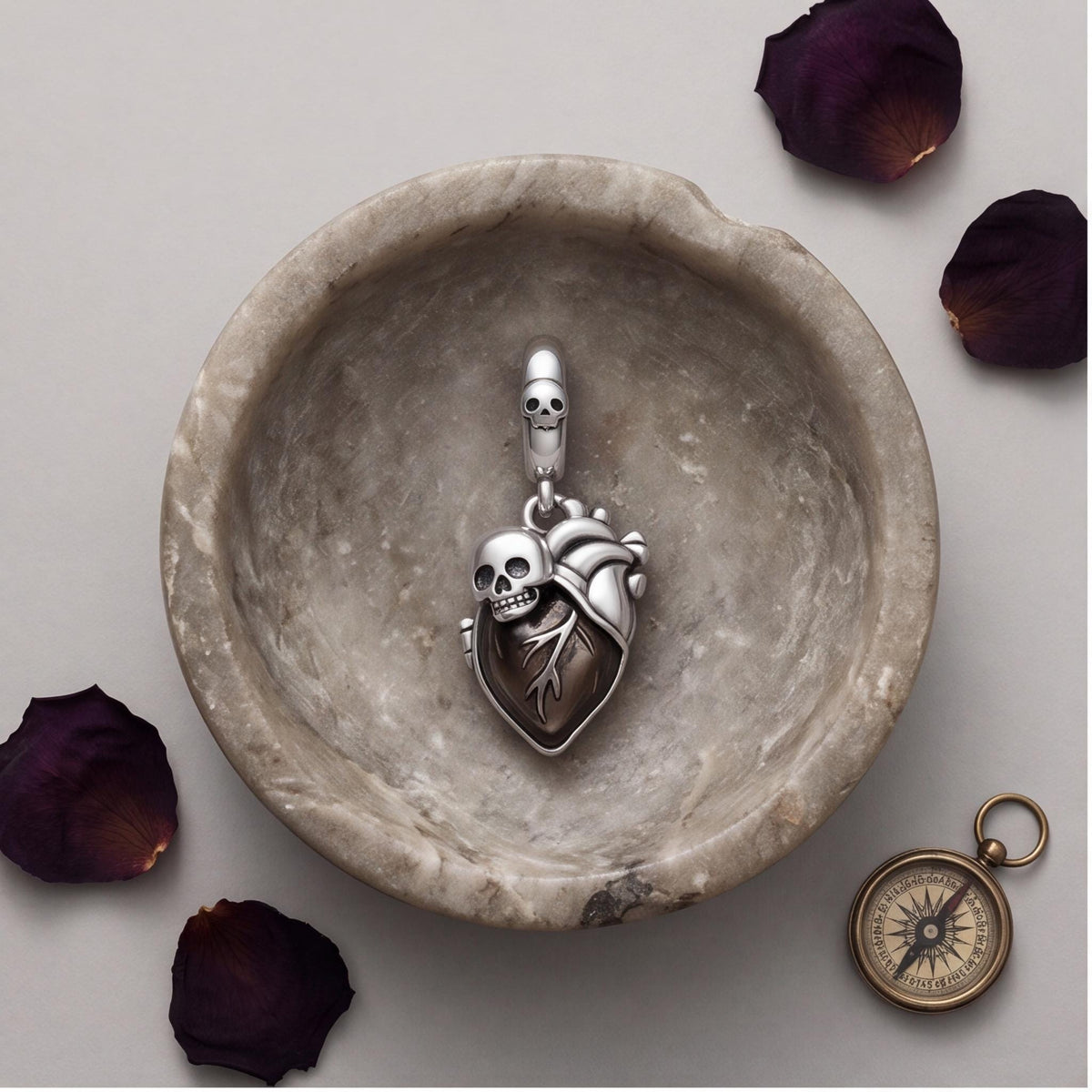 Skull Heart Dangle close-up on a bracelet