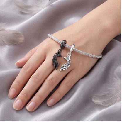 Angel Wing Dangle Charm close-up on a bracelet