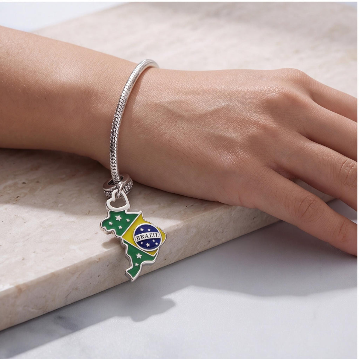 Brazil Map Charm worn on a charm bracelet