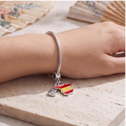 Spain Map Guitar Dangle worn on a charm bracelet