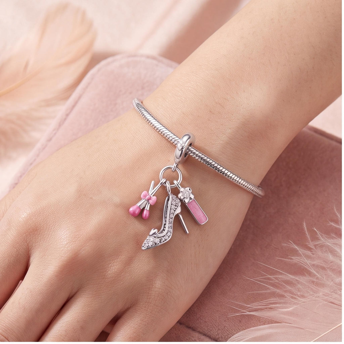 Glam Makeup Dangle Charm close-up on a bracelet