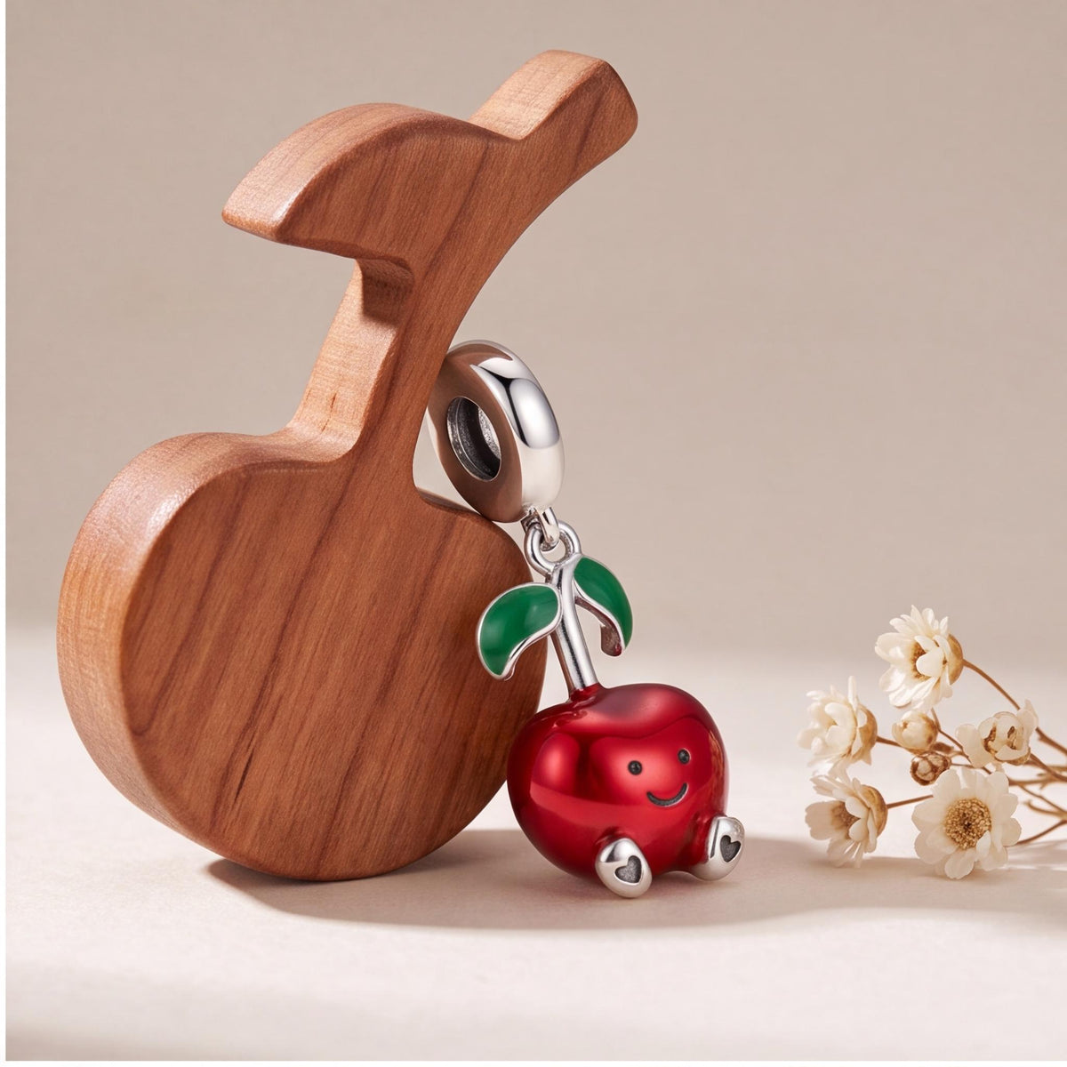 Smiley Apple Dangle Charm on a silver charm bracelet
