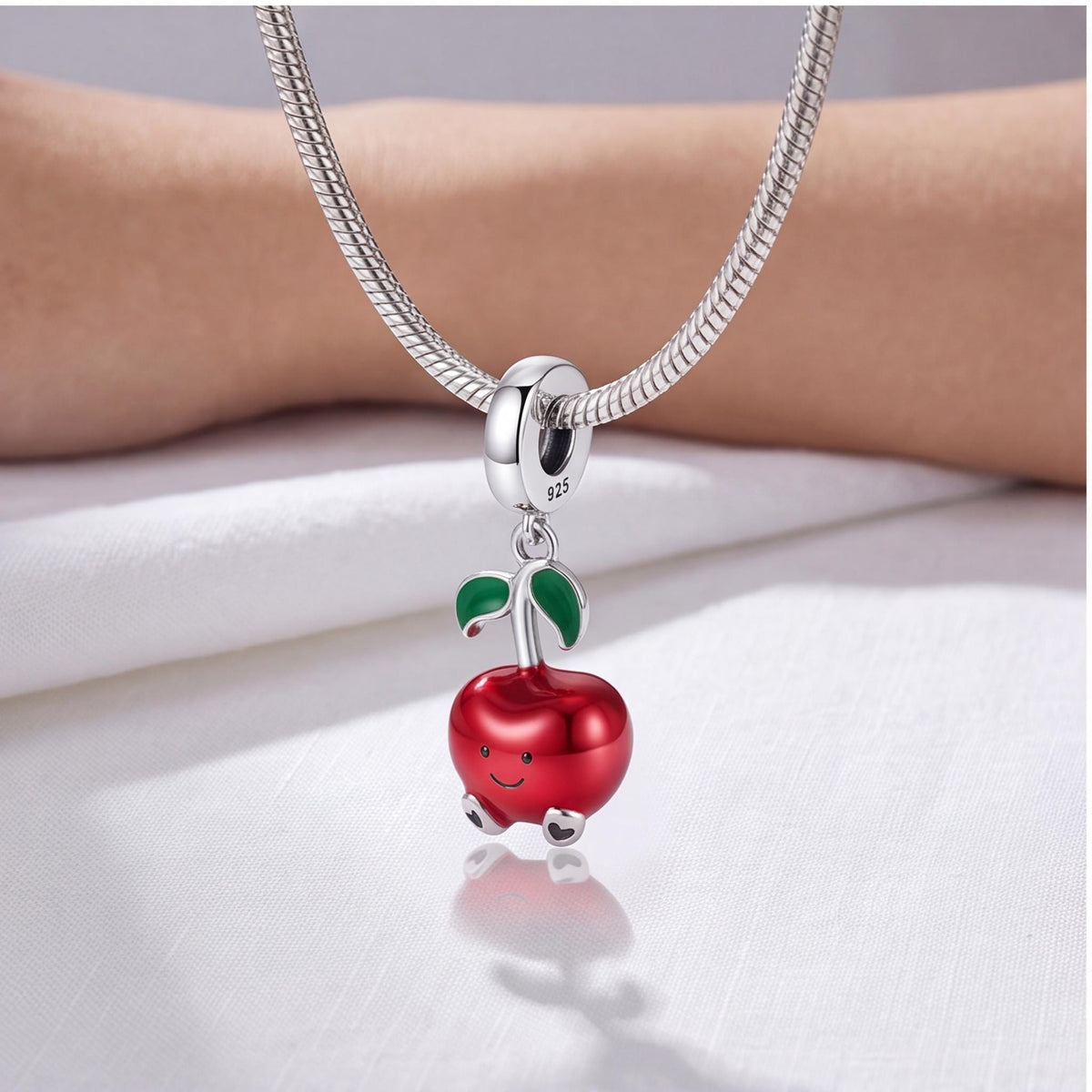 Smiley Apple Dangle Charm on a bracelet with other charms