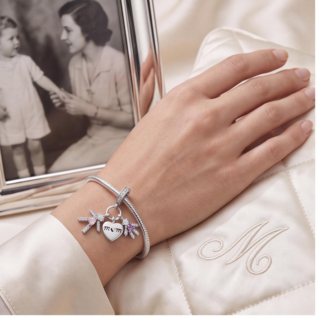Mom Heart Kids Dangle Charm worn on a charm bracelet