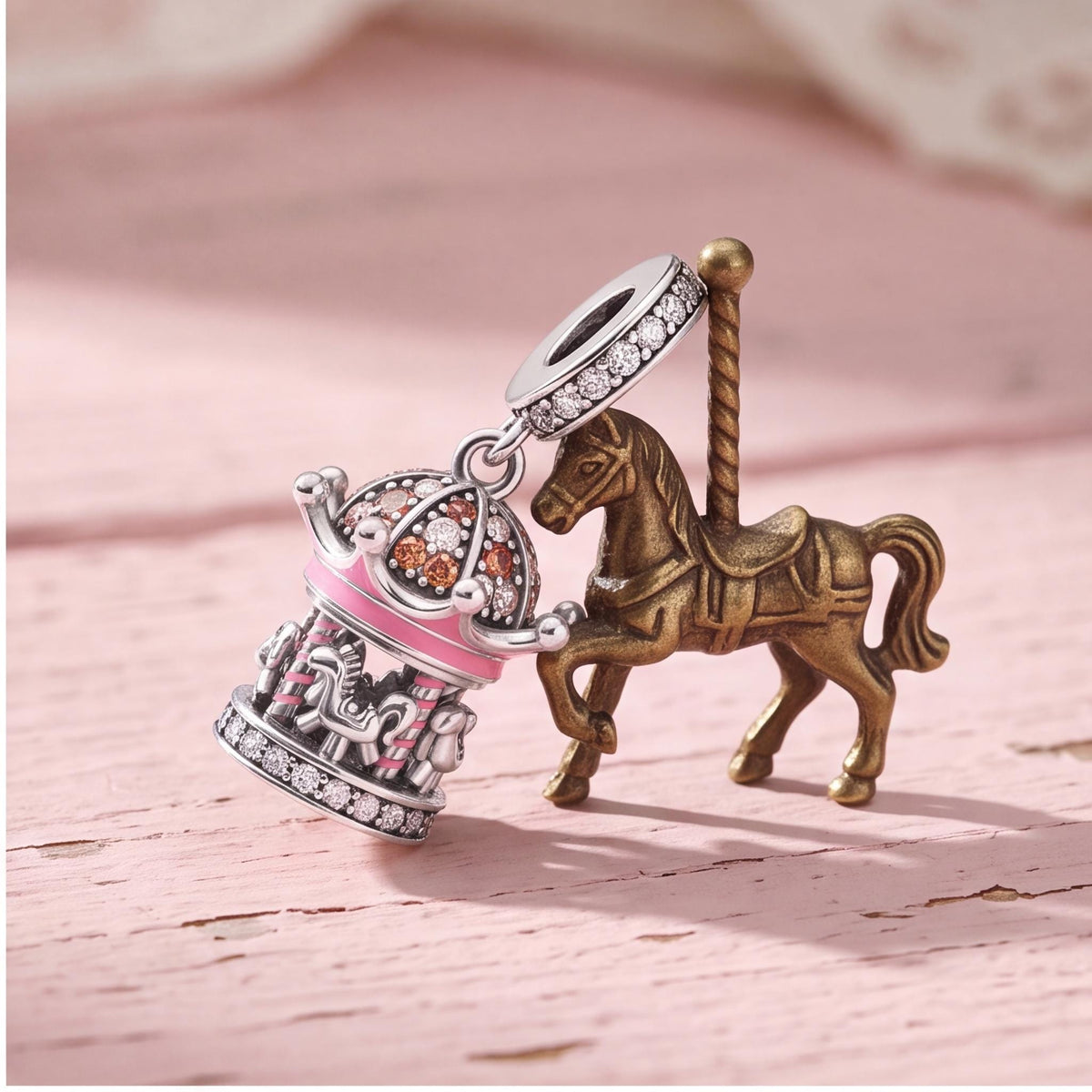Pink Fairground Carousel Dangle on a silver charm bracelet