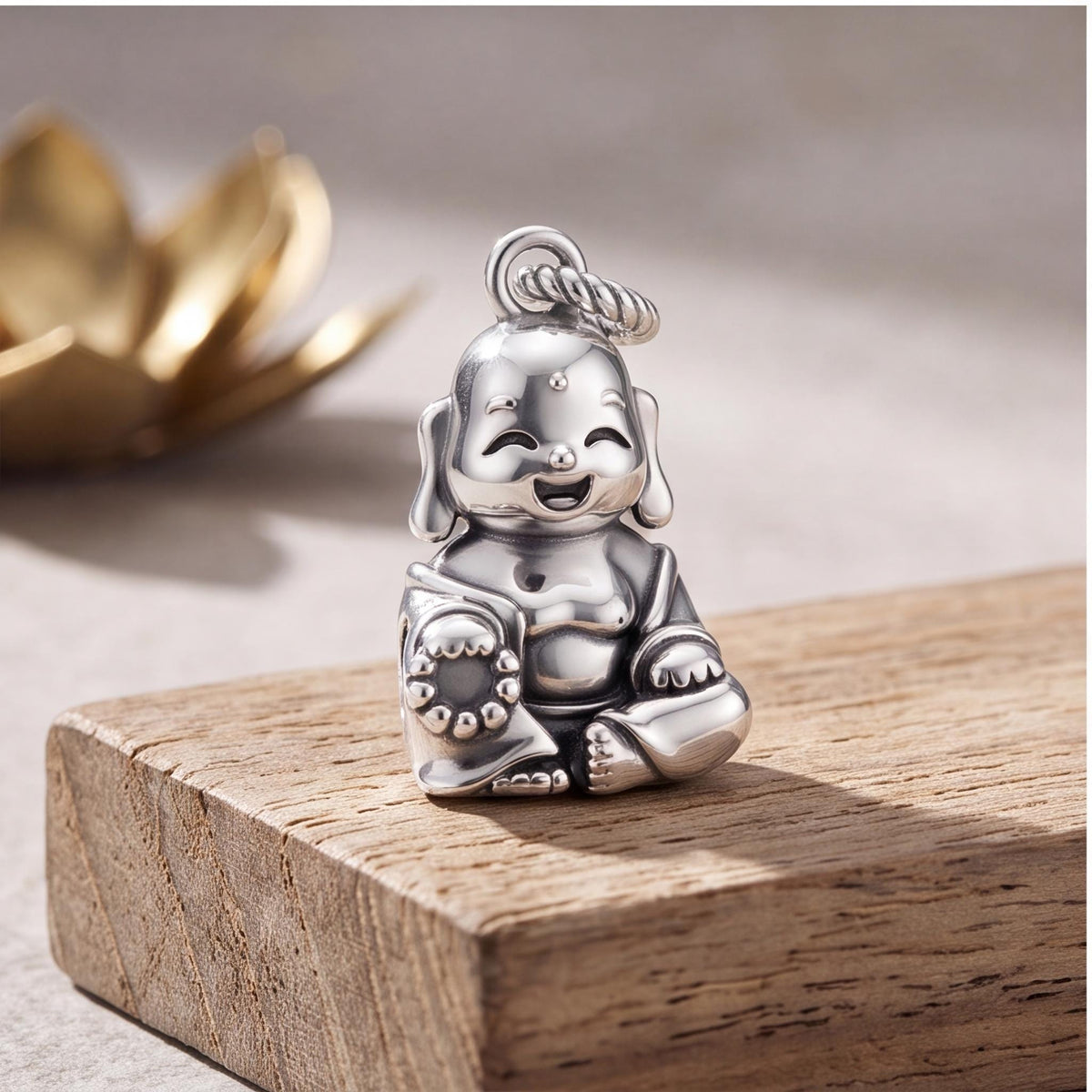 Laughing Buddha Dangle styled as a gift