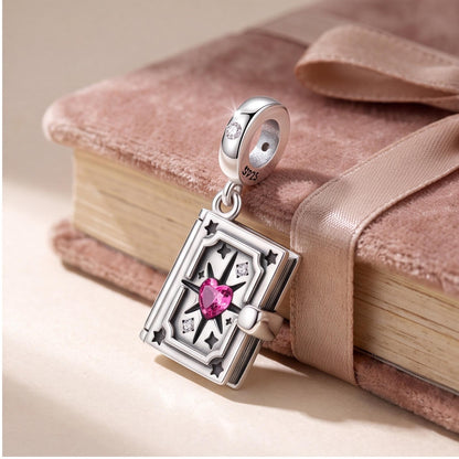 Magic Book Locket Charm on a silver charm bracelet