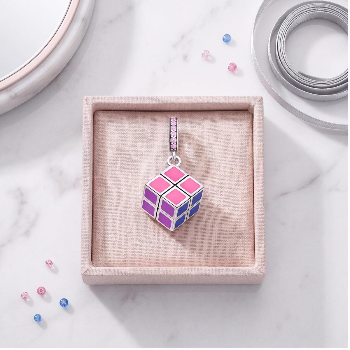 Puzzle Cube Dangle Charm on a silver charm bracelet