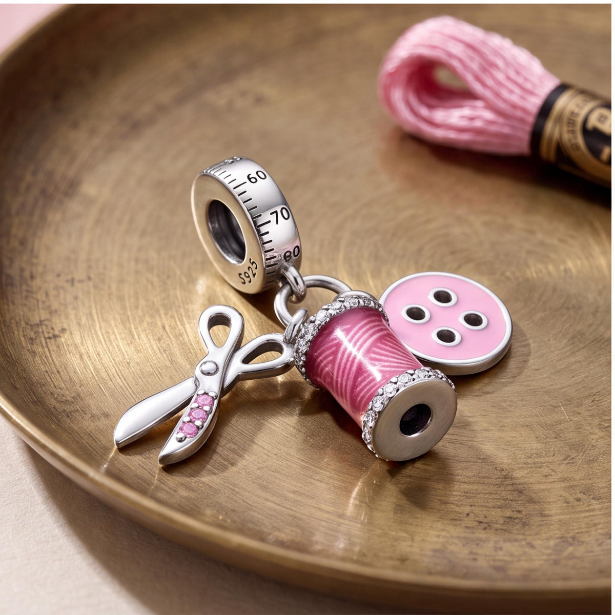 Sewing Dangle Charm on a silver charm bracelet