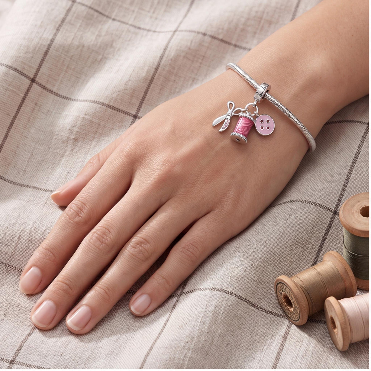 Sewing Dangle Charm close-up on a bracelet