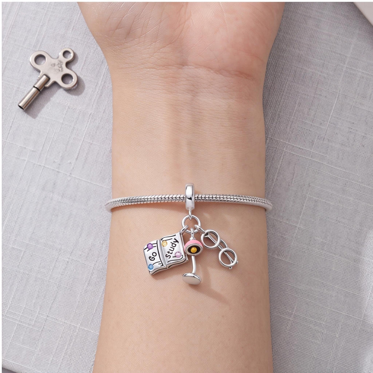 Study Dangle Charm worn on a charm bracelet