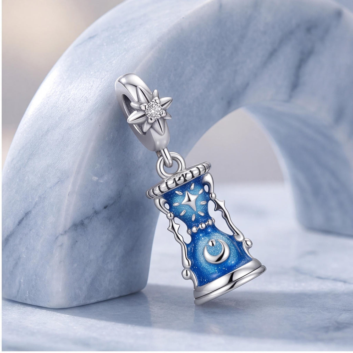Celestial Hourglass Dangle on a silver charm bracelet