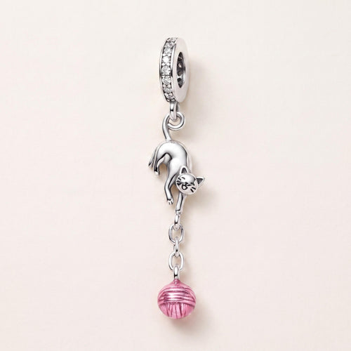 Playful Cat Yarn Charm in 925 sterling silver with pink enamel and sparkling stones, fits European-style charm bracelets