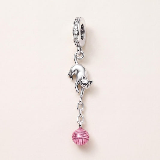 Playful Cat Yarn Charm in 925 sterling silver with pink enamel and sparkling stones, fits European-style charm bracelets