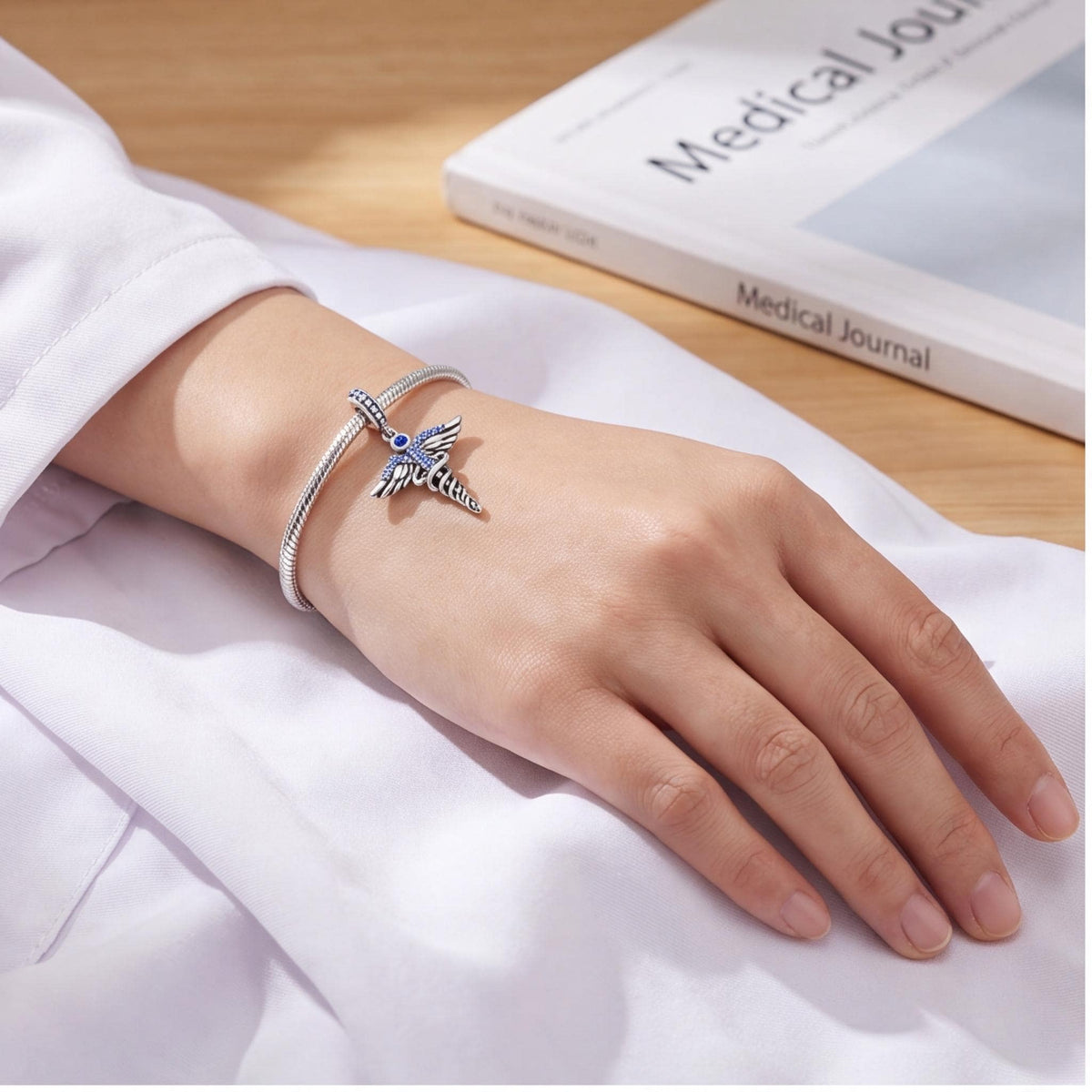 Medical Caduceus Dangle Charm worn on a charm bracelet