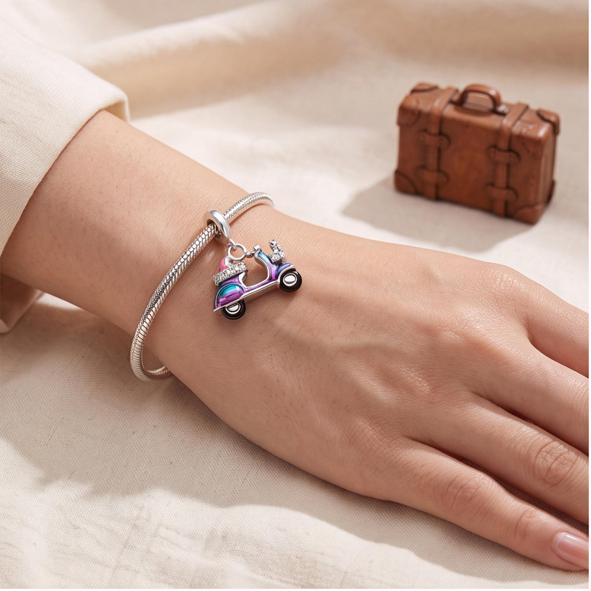 Scooter Dangle Charm worn on a charm bracelet