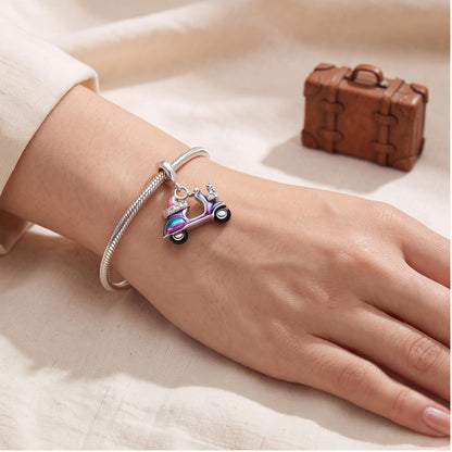 Scooter Dangle Charm worn on a charm bracelet
