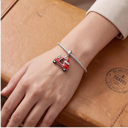 Red Scooter Dangle close-up on a bracelet
