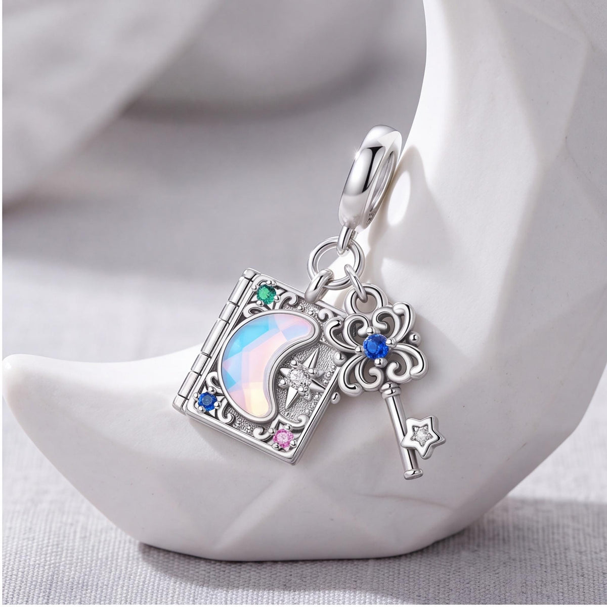 Magic Book Key Dangle on a silver charm bracelet