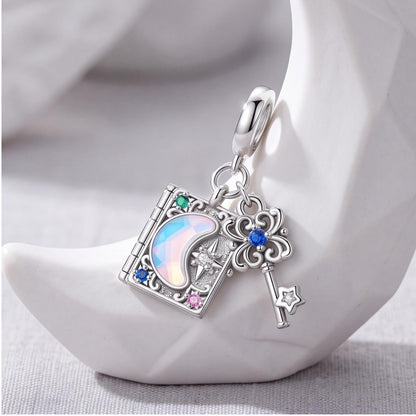 Magic Book Key Dangle on a silver charm bracelet