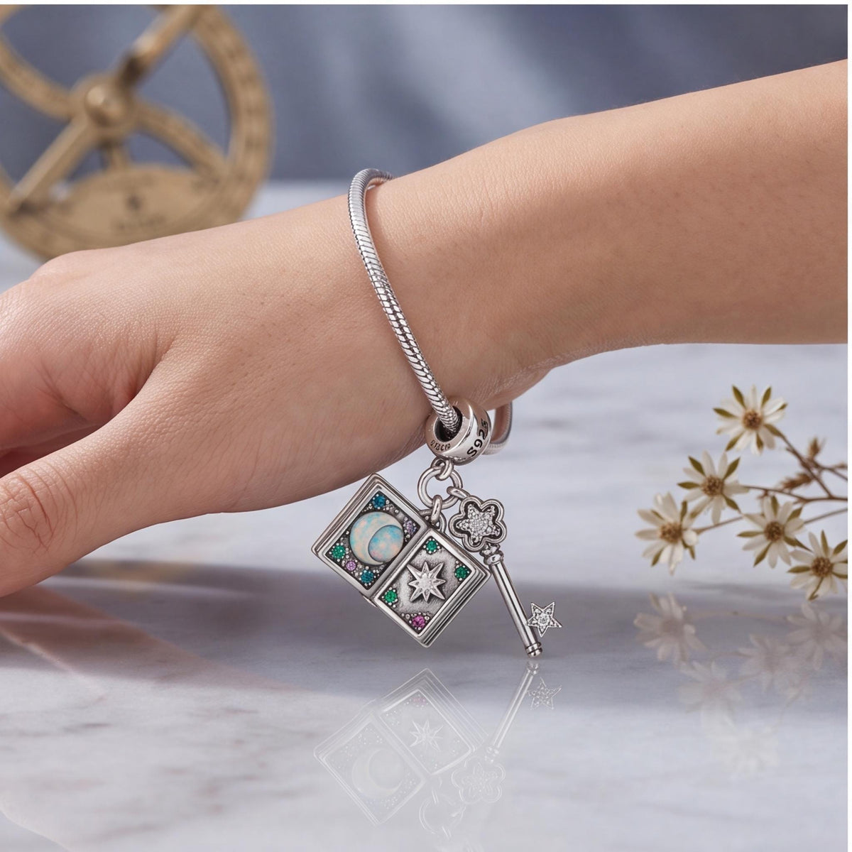 Magic Book Key Dangle worn on a charm bracelet