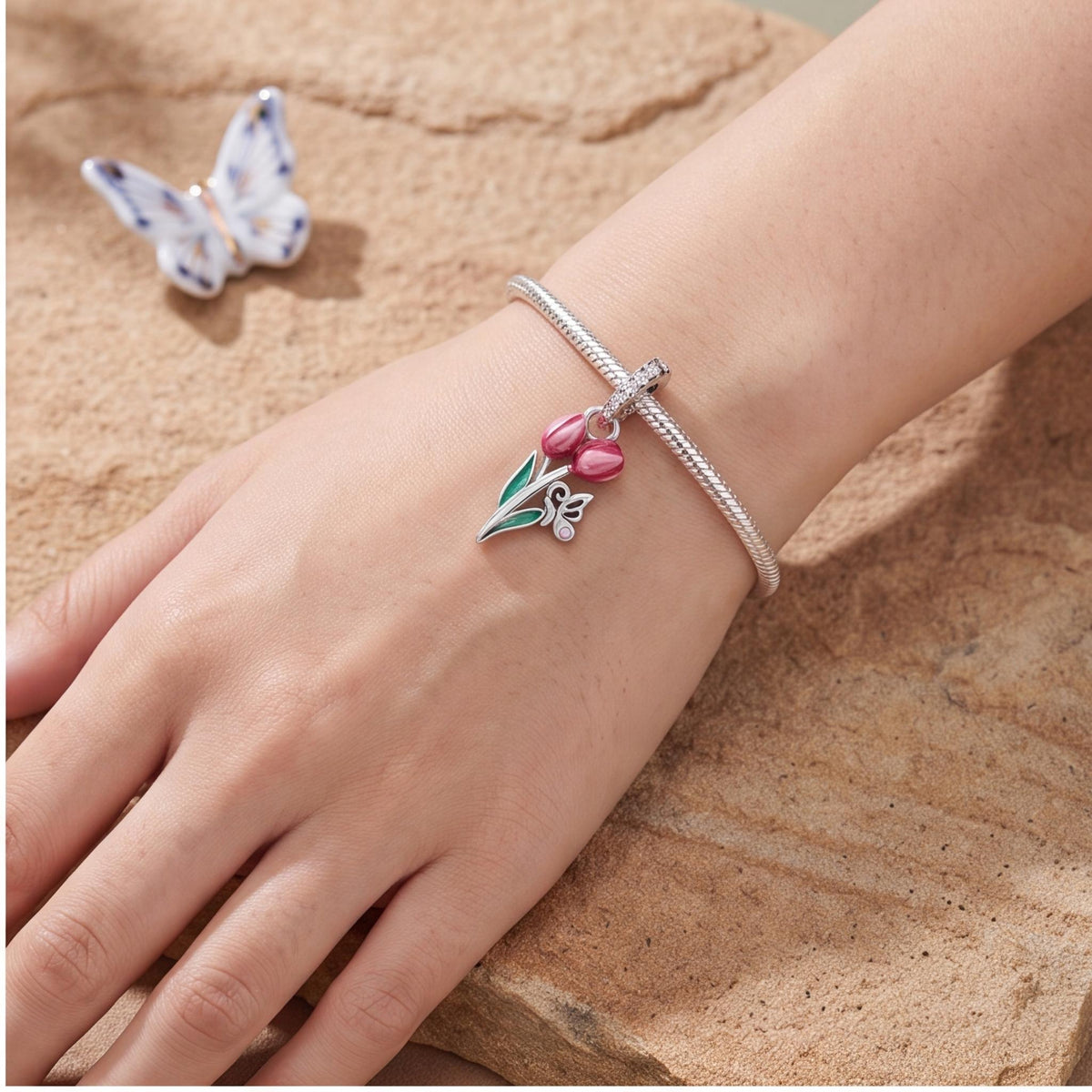 Tulip Butterfly Charm close-up on a bracelet