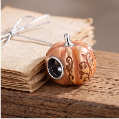 Pumpkin Bead Charm on a silver charm bracelet