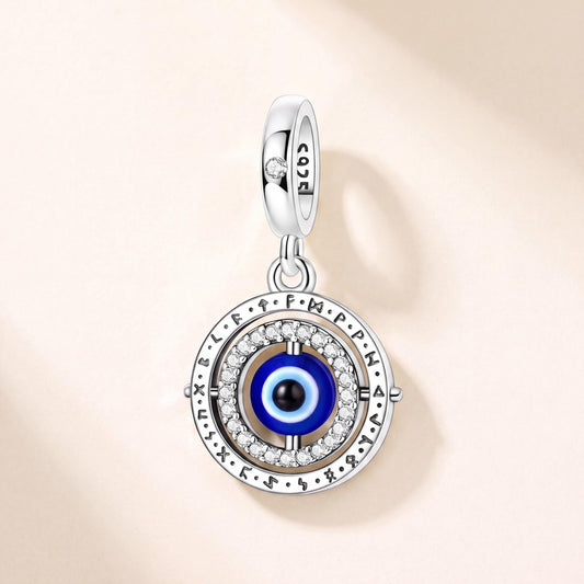 Evil Eye Spinning Dangle in 925 sterling silver with blue and black enamel and sparkling stones