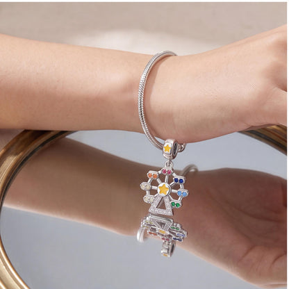 Rainbow Ferris Wheel Dangle worn on a charm bracelet