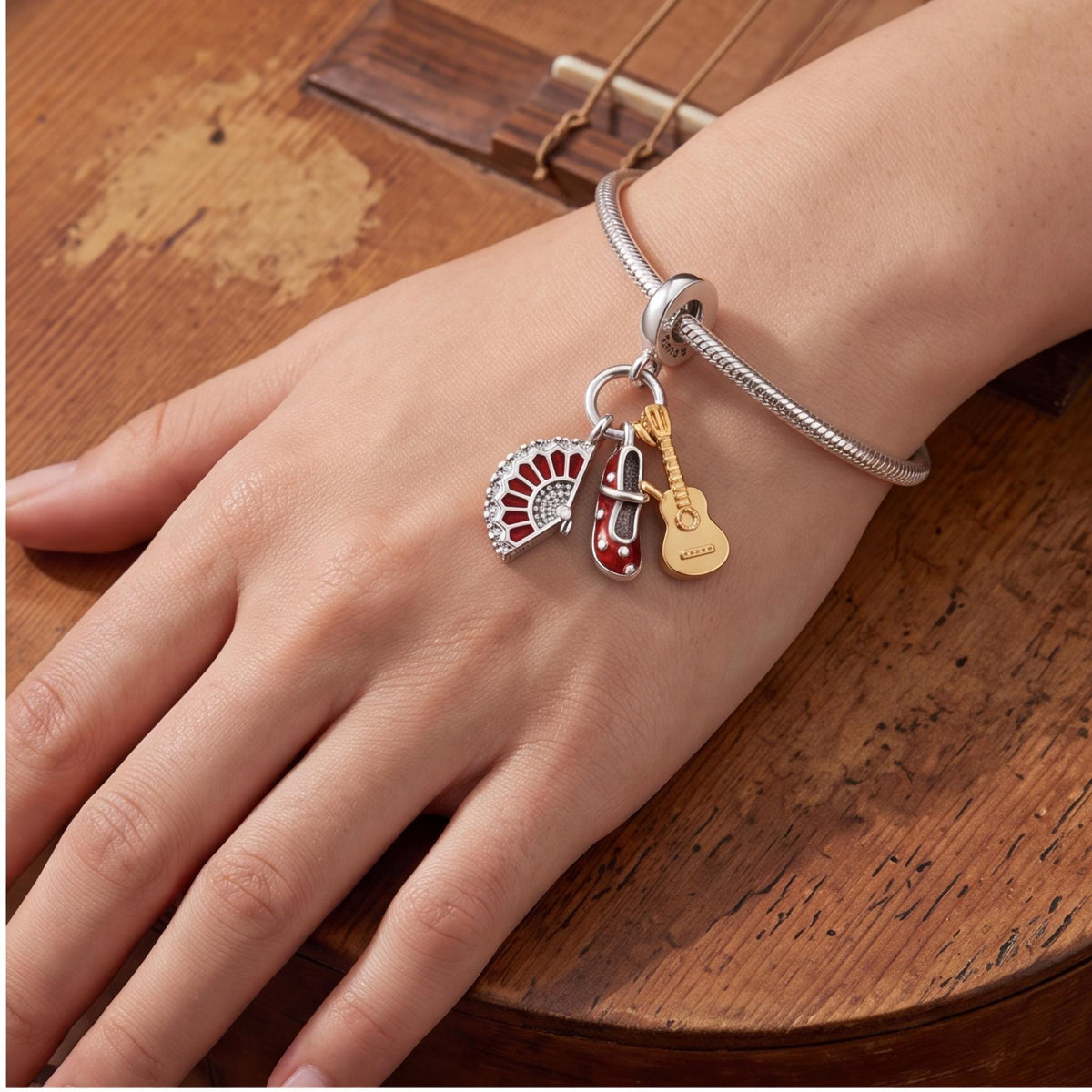 Flamenco Dangle Charm close-up on a bracelet
