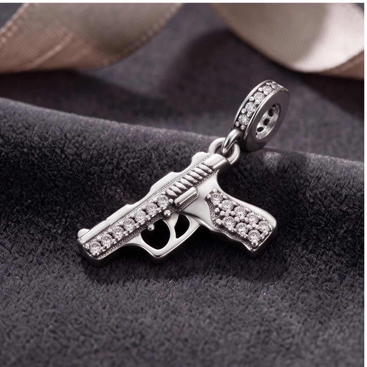 Gun Dangle Charm on a silver charm bracelet