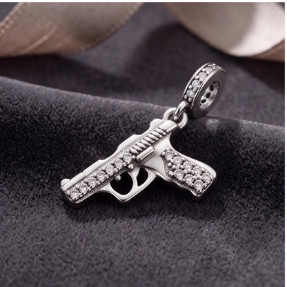 Gun Dangle Charm on a silver charm bracelet