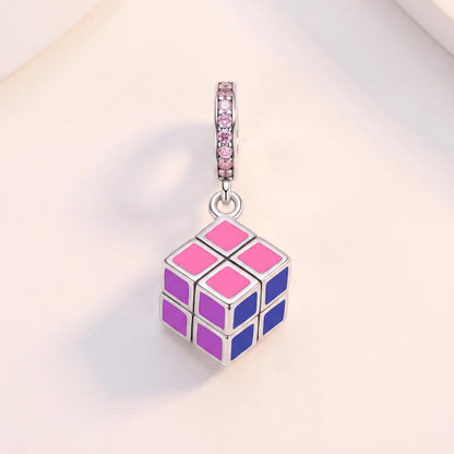 Puzzle Cube Dangle Charm in 925 sterling silver with pink and purple enamel and sparkling stones