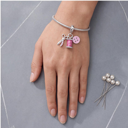Sewing Dangle Charm worn on a charm bracelet