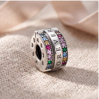 Forever Rainbow Clip on a silver charm bracelet