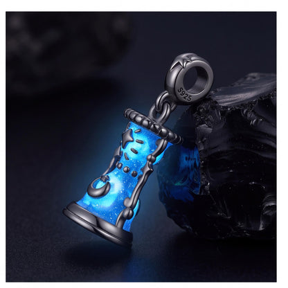 Celestial Hourglass Dangle worn on a charm bracelet