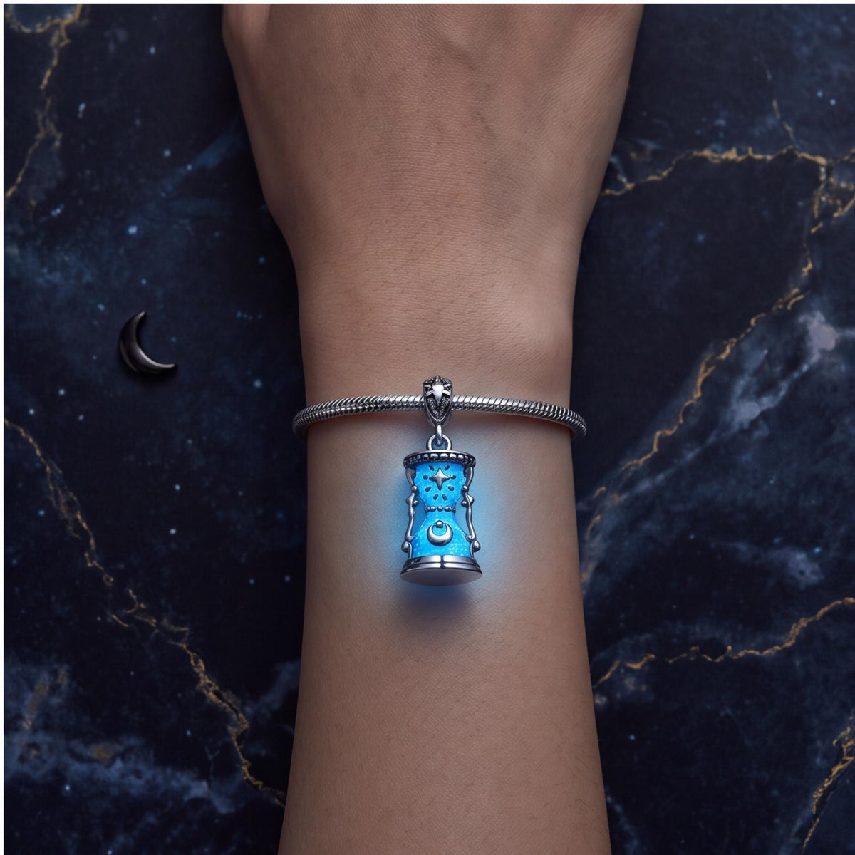Celestial Hourglass Dangle close-up on a bracelet