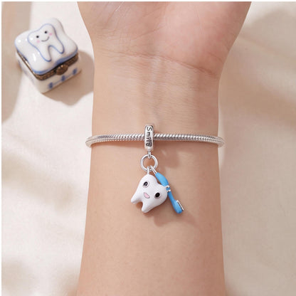 Dentist Tooth Charm worn on a charm bracelet