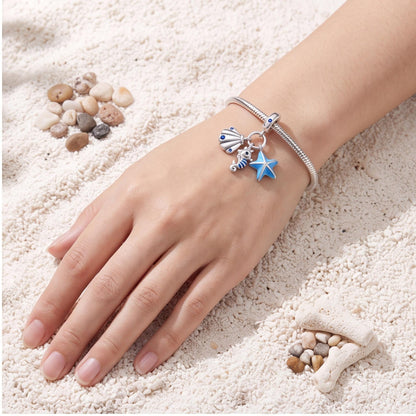 Ocean Trio Dangle Charm close-up on a bracelet