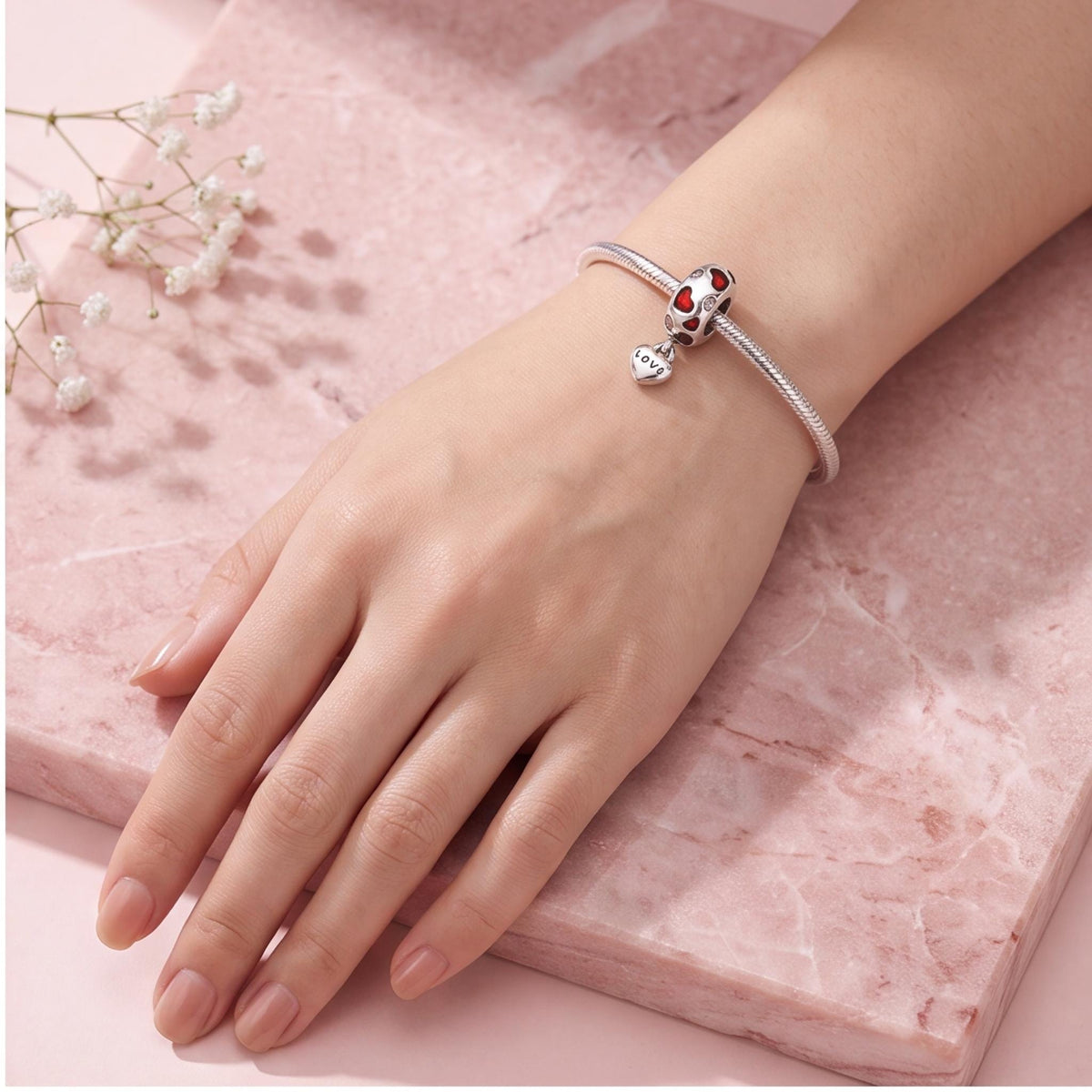 Red Enamel Love Heart Charm close-up on a bracelet