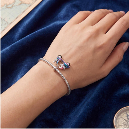 Scooter Dangle Charm close-up on a bracelet