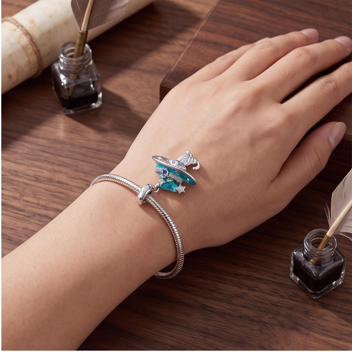 Witch Cat Dangle Charm close-up on a bracelet