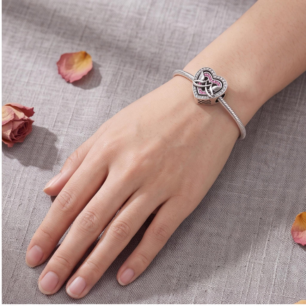 Love Doves Heart Bead worn on a charm bracelet