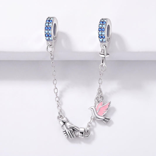Dove Safety Chain Charm in 925 sterling silver with pink and blue enamel and sparkling stones