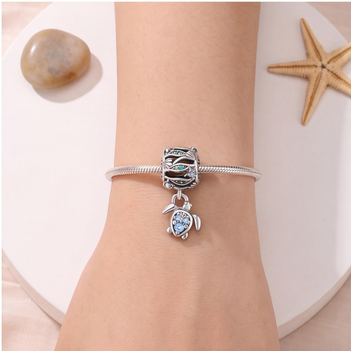 Ocean Wave Sea Turtle Dangle close-up on a bracelet
