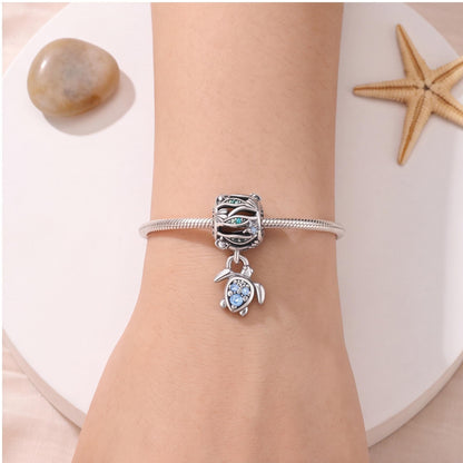 Ocean Wave Sea Turtle Dangle close-up on a bracelet