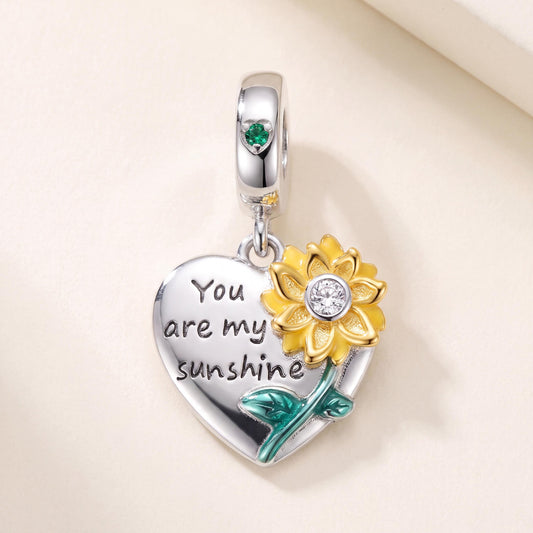 Sunflower Heart Dangle in 925 sterling silver with gold and green enamel and sparkling stones