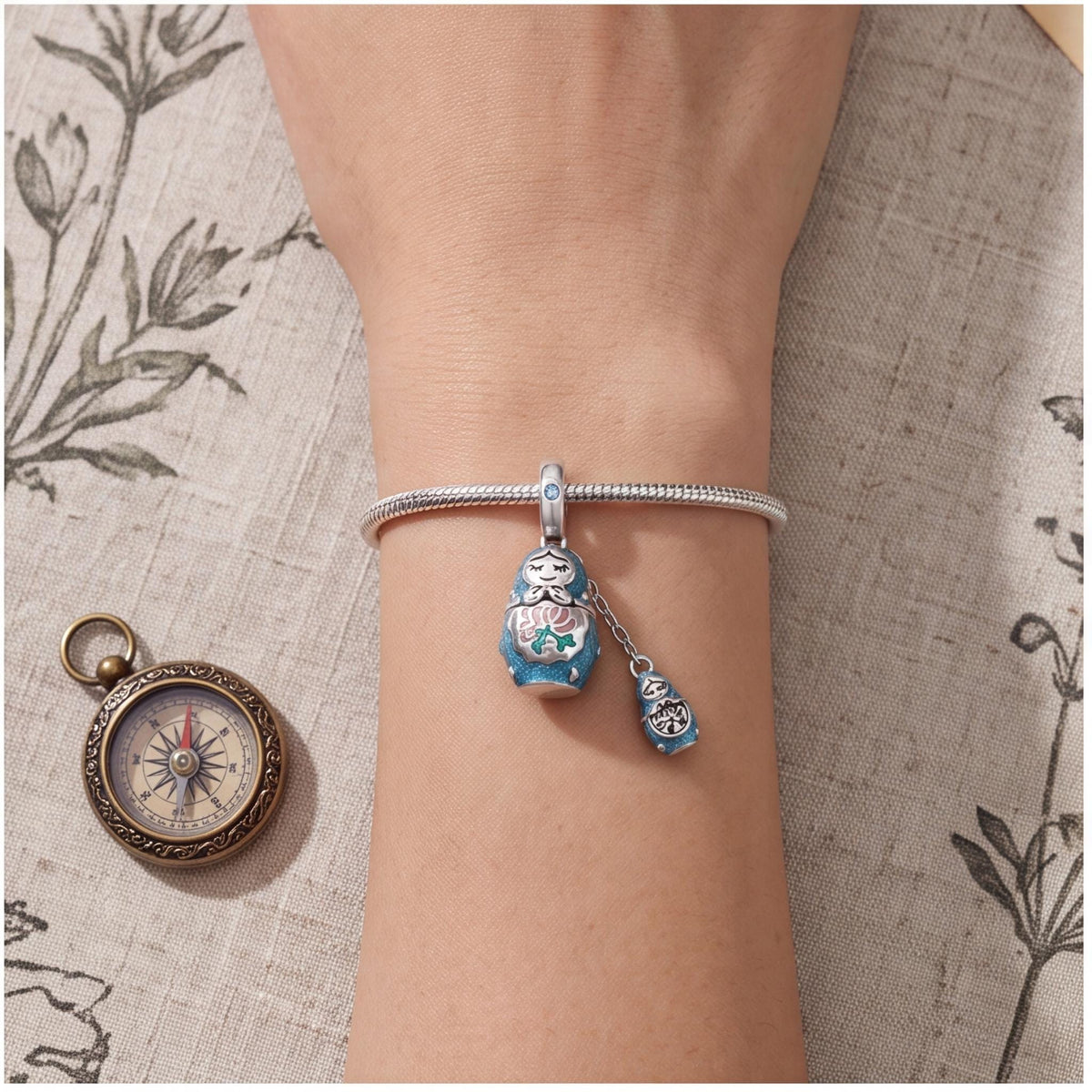Nesting Doll Dangle worn on a charm bracelet