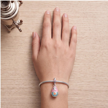 Nesting Doll Charm worn on a charm bracelet